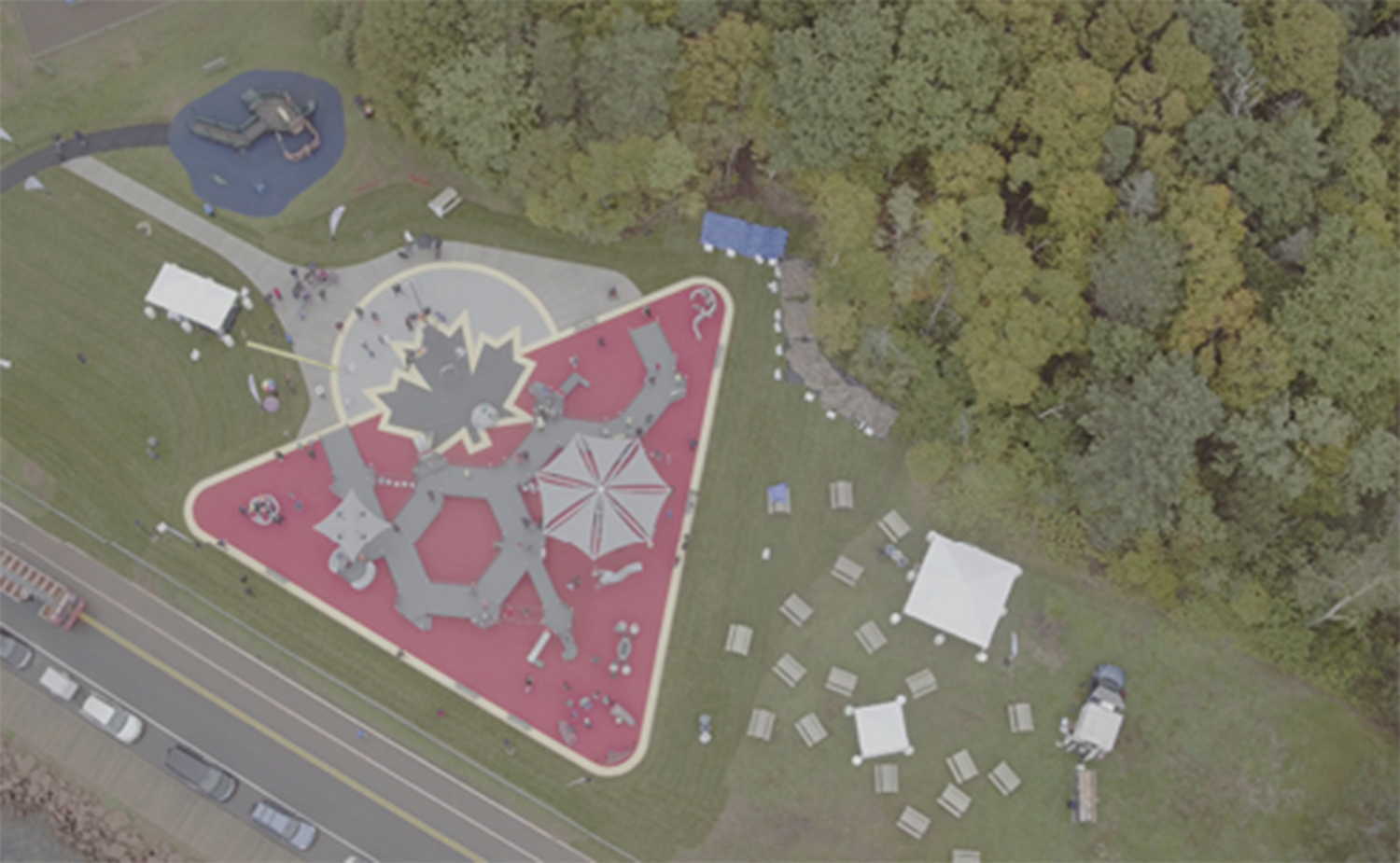 Aerial view of a Canadian Tire Jumpstart playground with equipment and walking paths